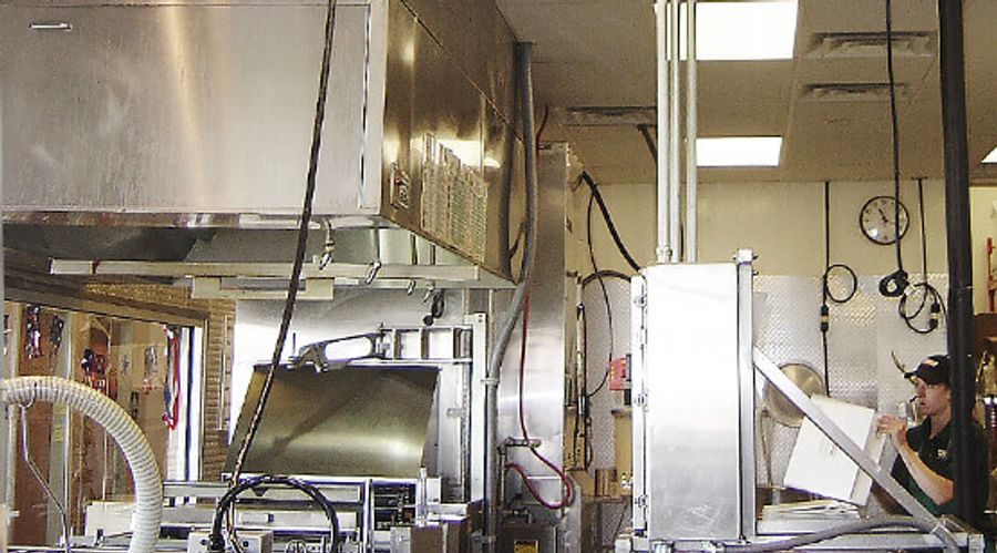 Commercial kitchen equipment and extraction hood