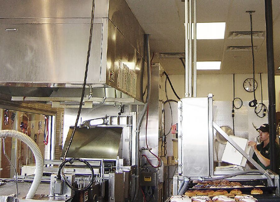 Commercial kitchen equipment and extraction hood