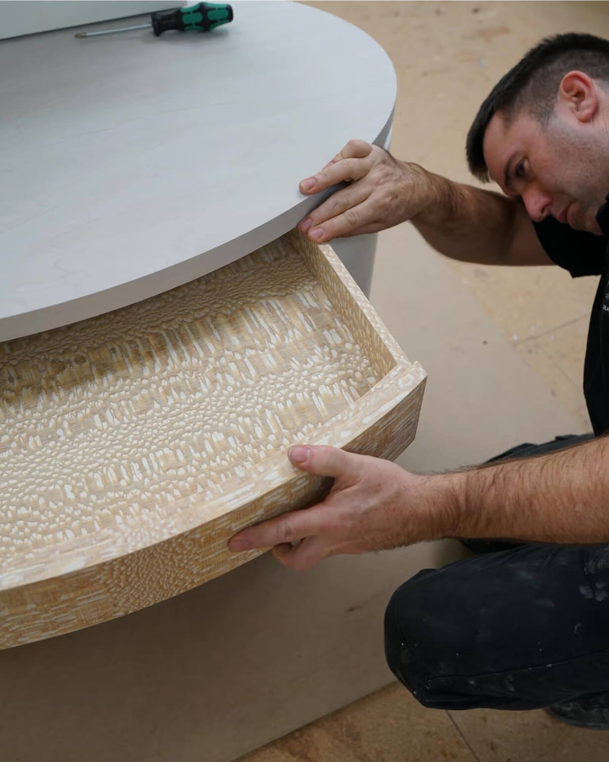 A close up of a craftsman working on a joinery product.