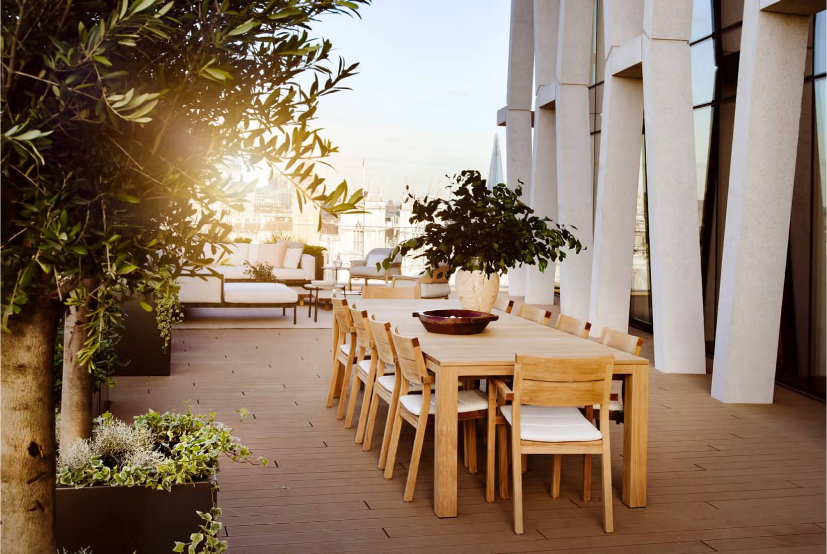 A roof terrace dining area with panoramic views of London.
