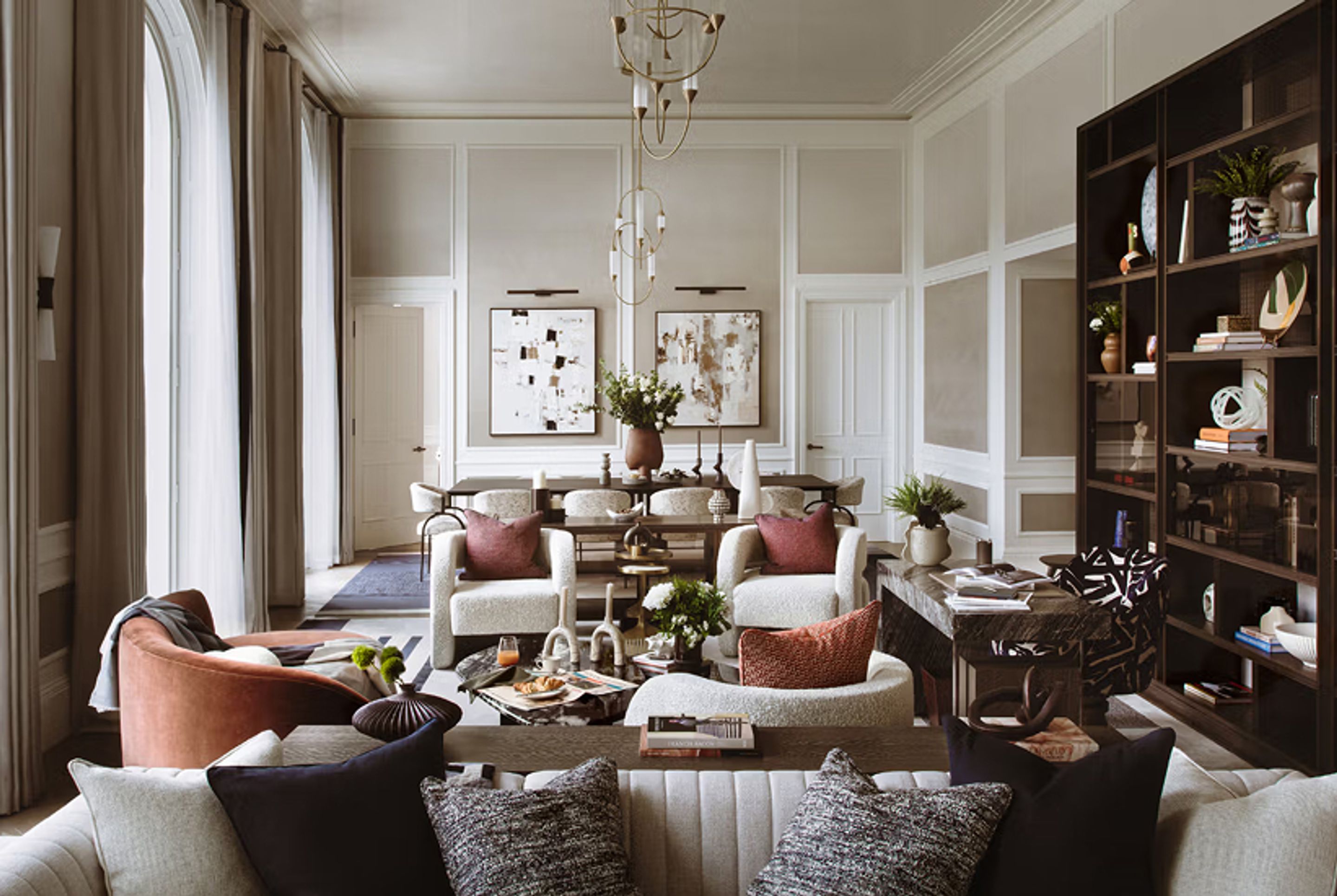 A large room with a seating area and dining area.