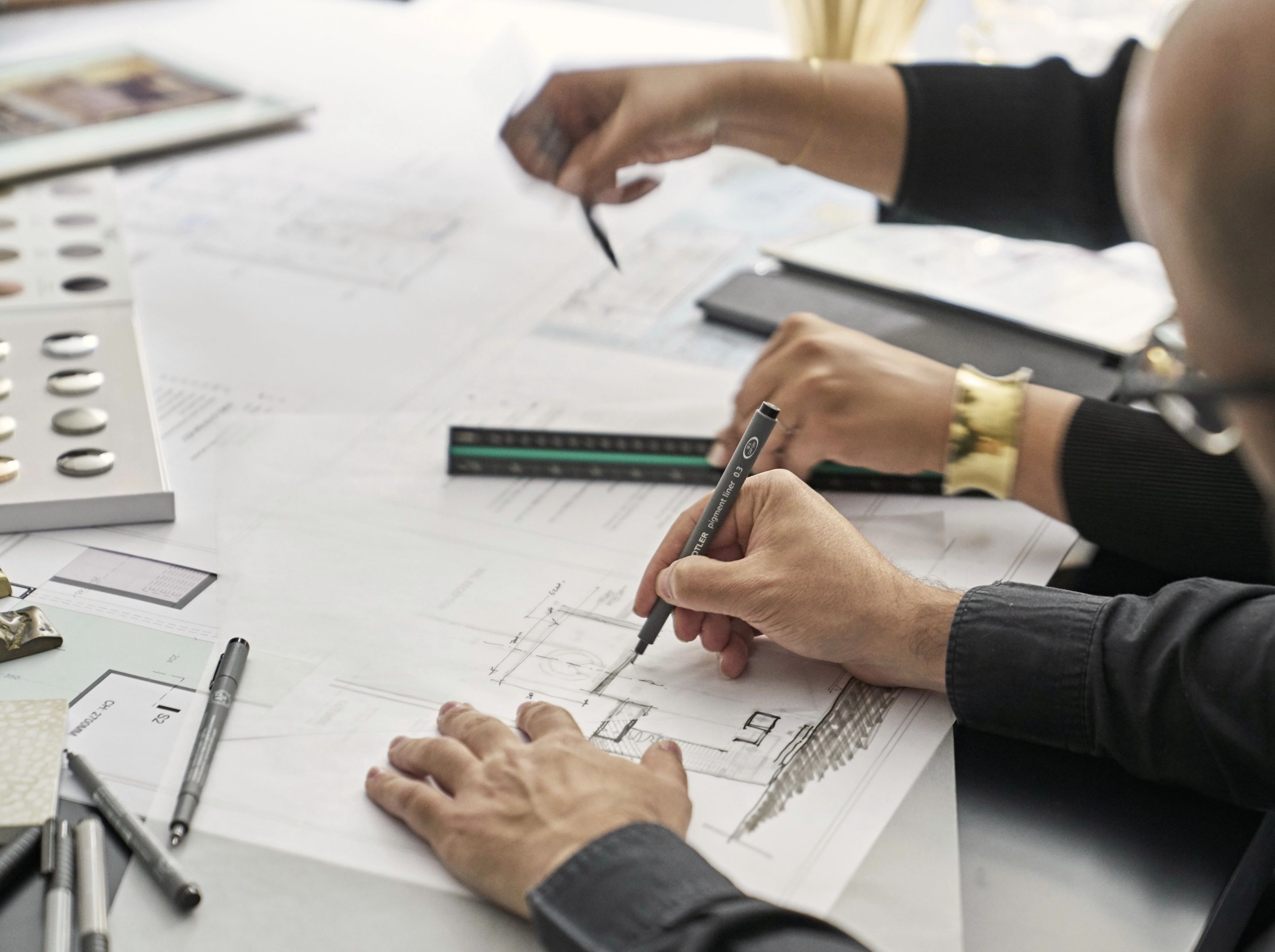 Team members drafting designs