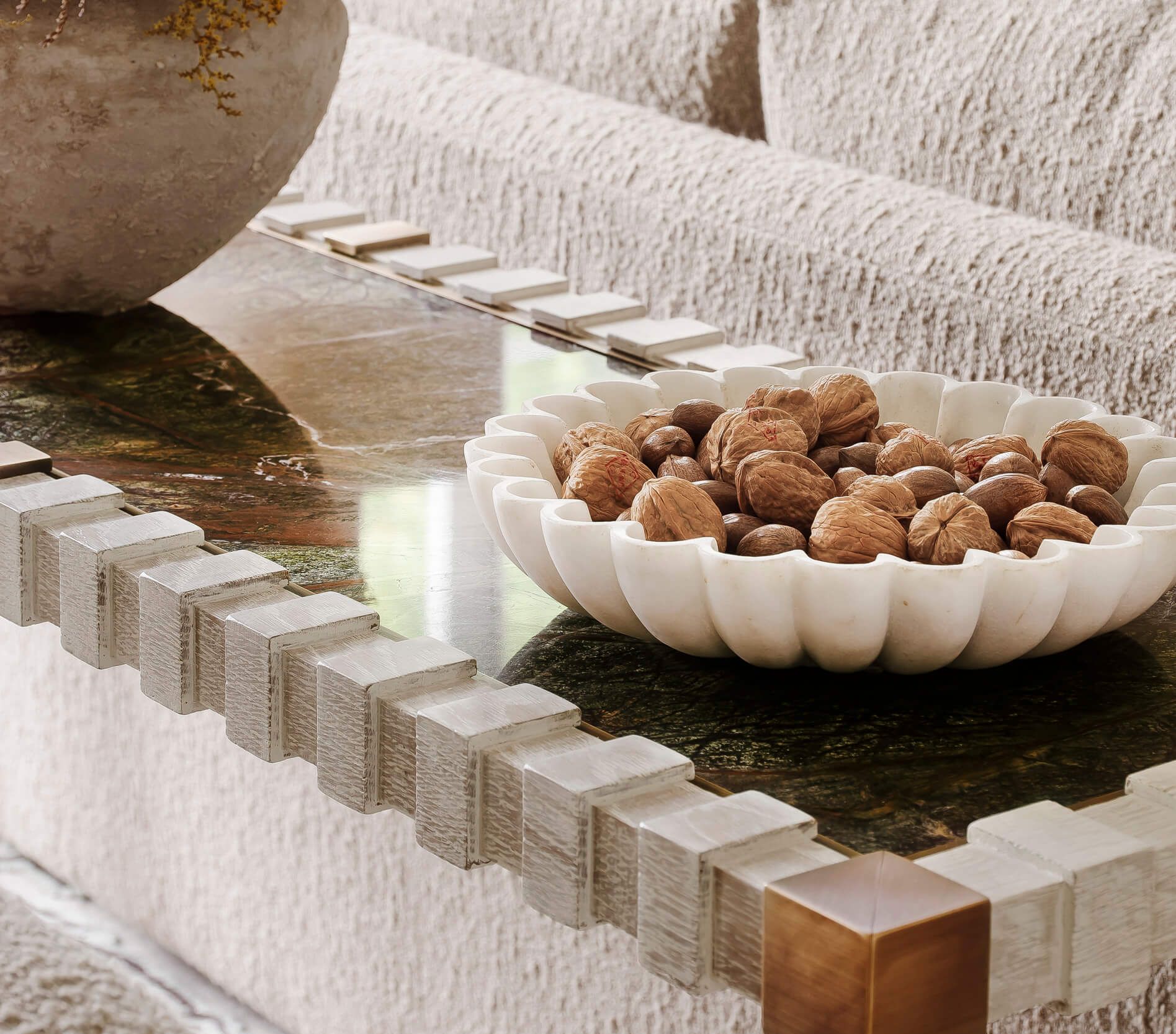 A bowl of walnuts on a coffee table