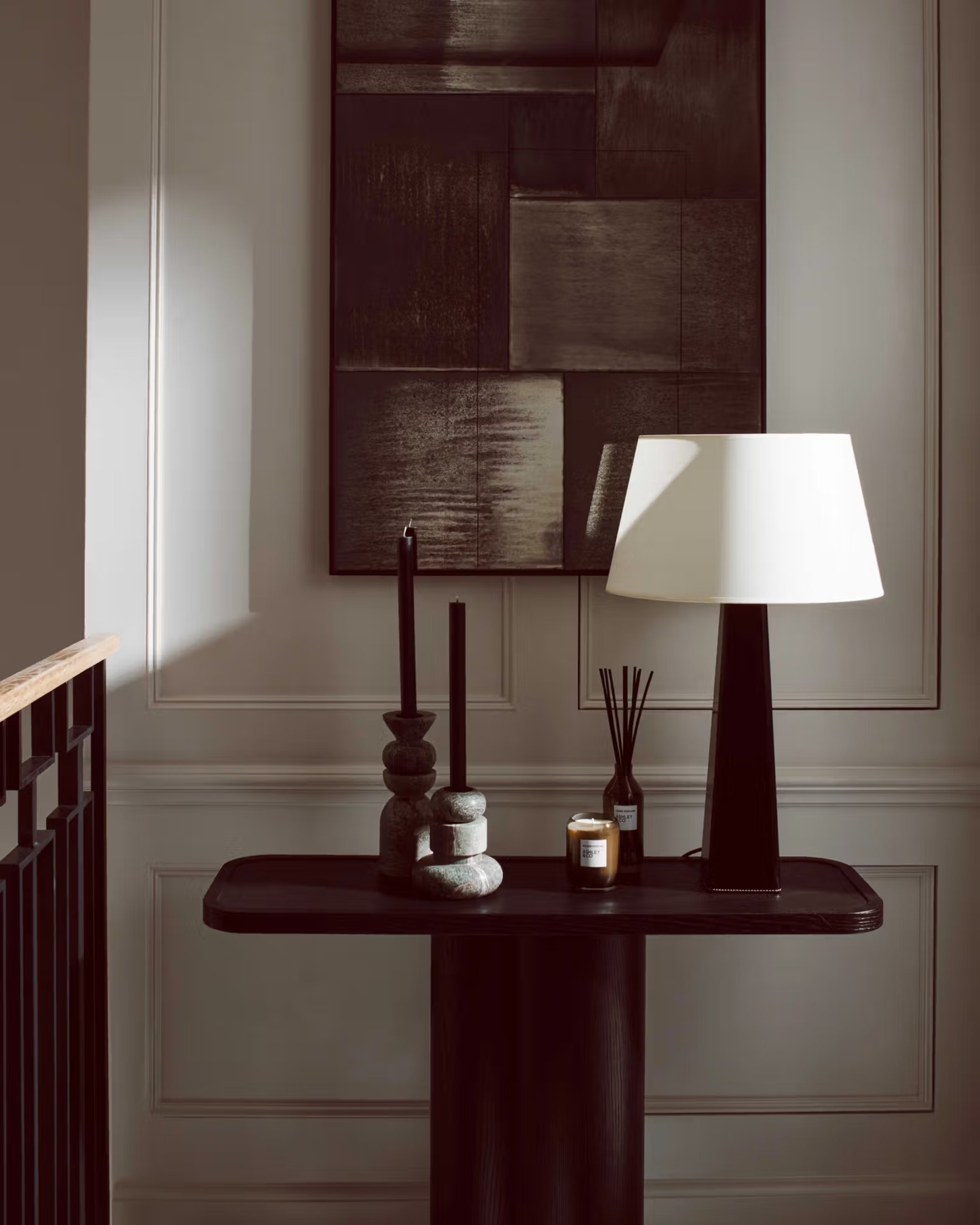 Table with a lamp and art