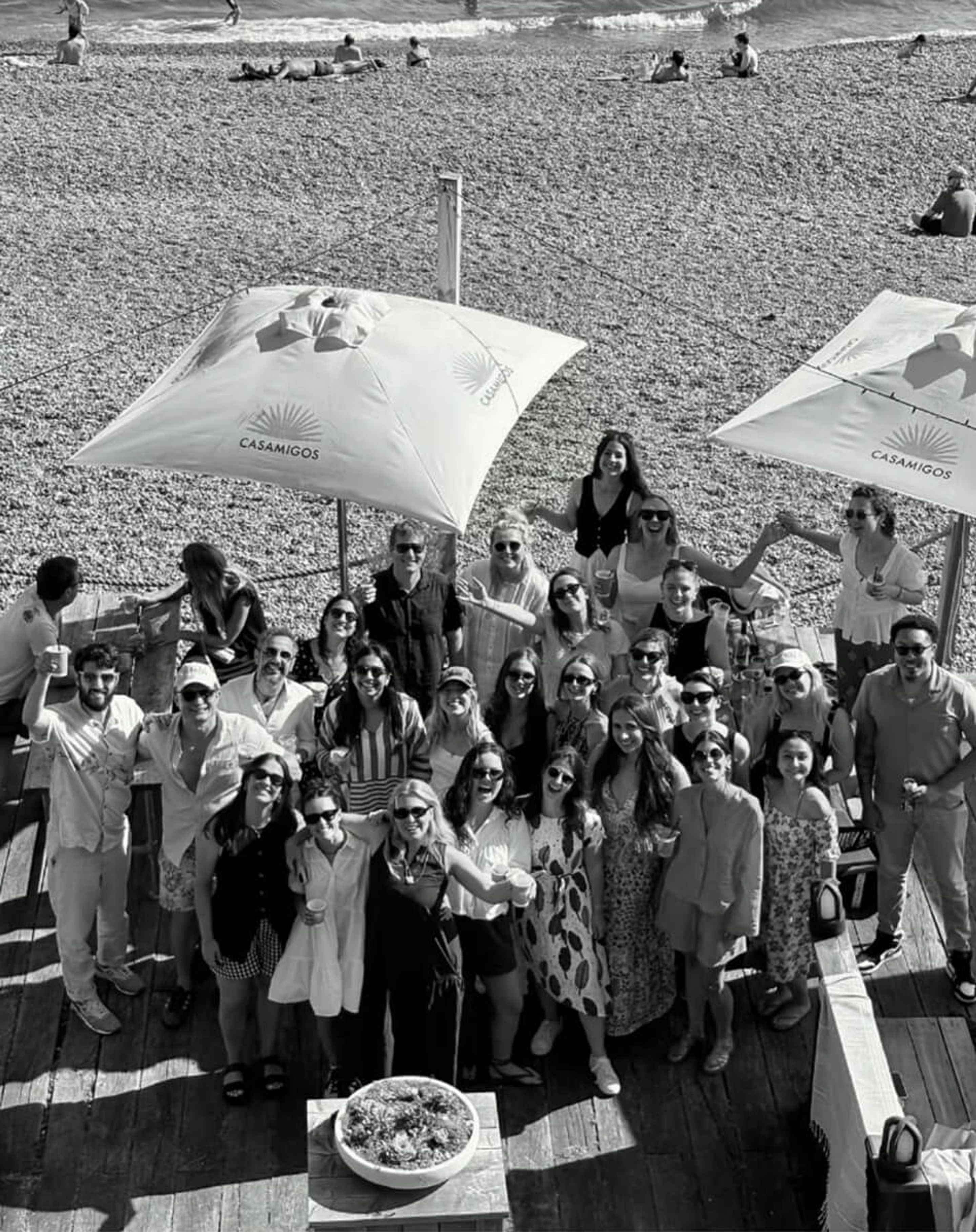 Elicyon team members at a staff event at a beach bar.
