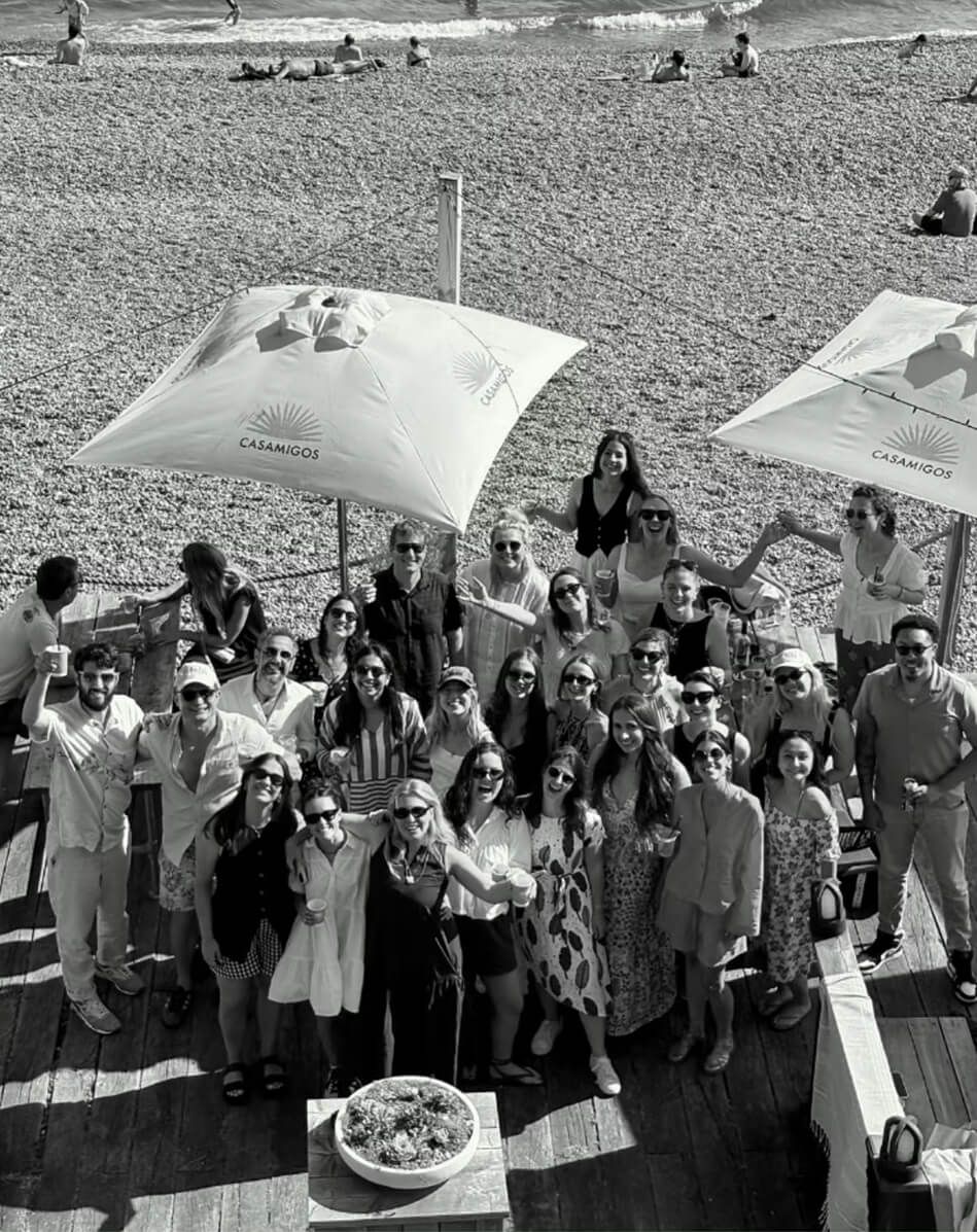 Elicyon team members at a staff event at a beach bar.