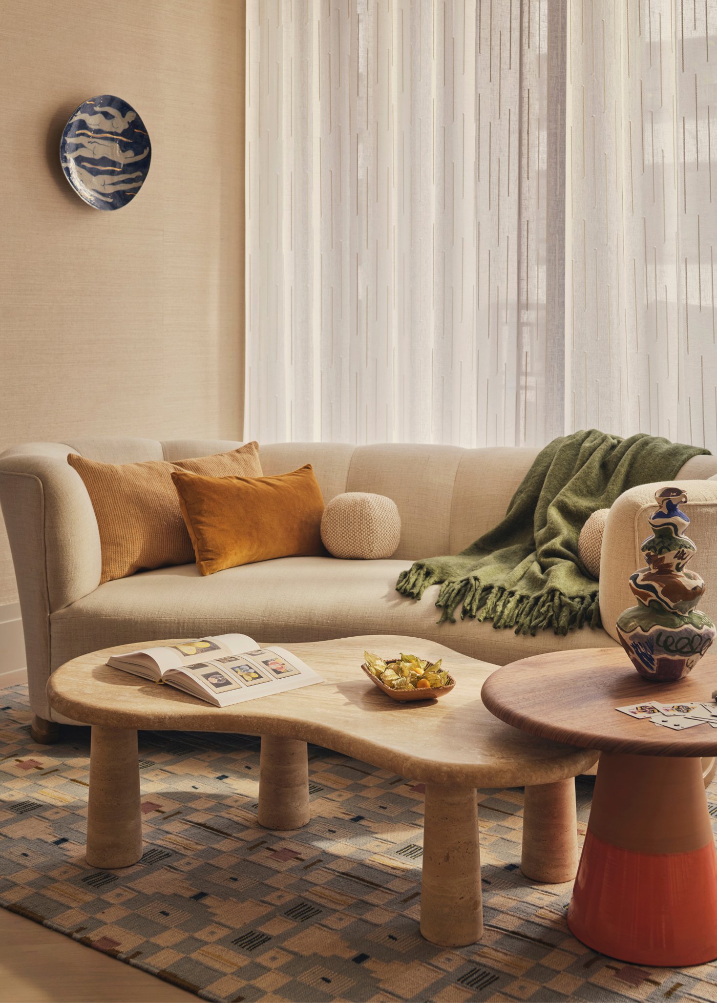 A living room setting with a couch and coffee tables.