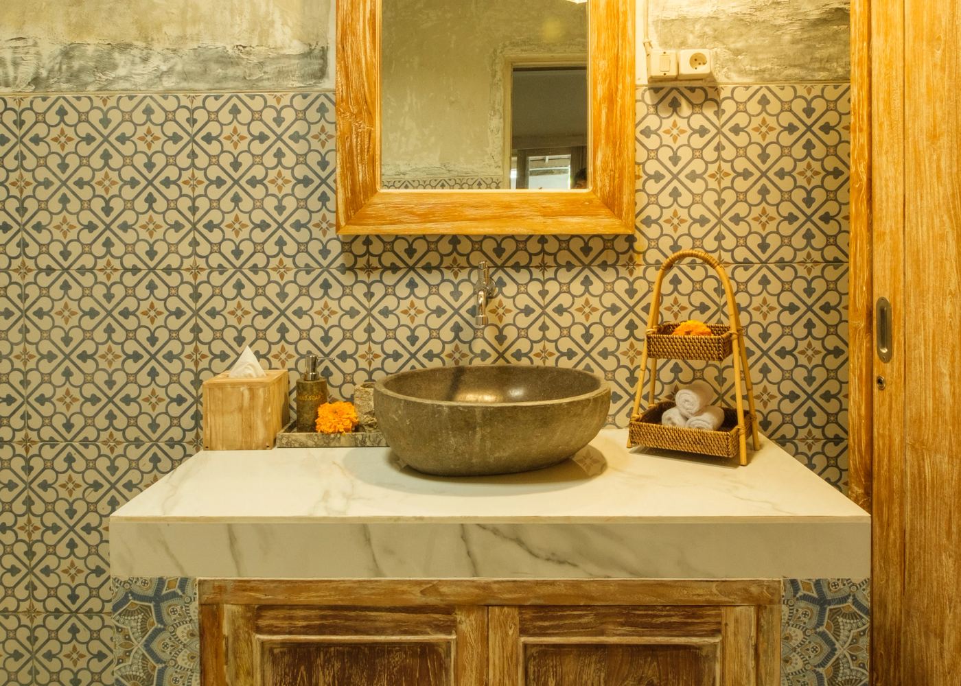 Stone basin vanity with hand-painted Balinese tiles