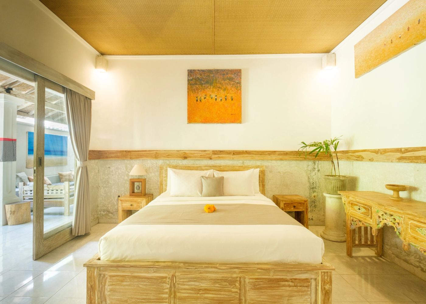 King bedroom with Balinese artwork