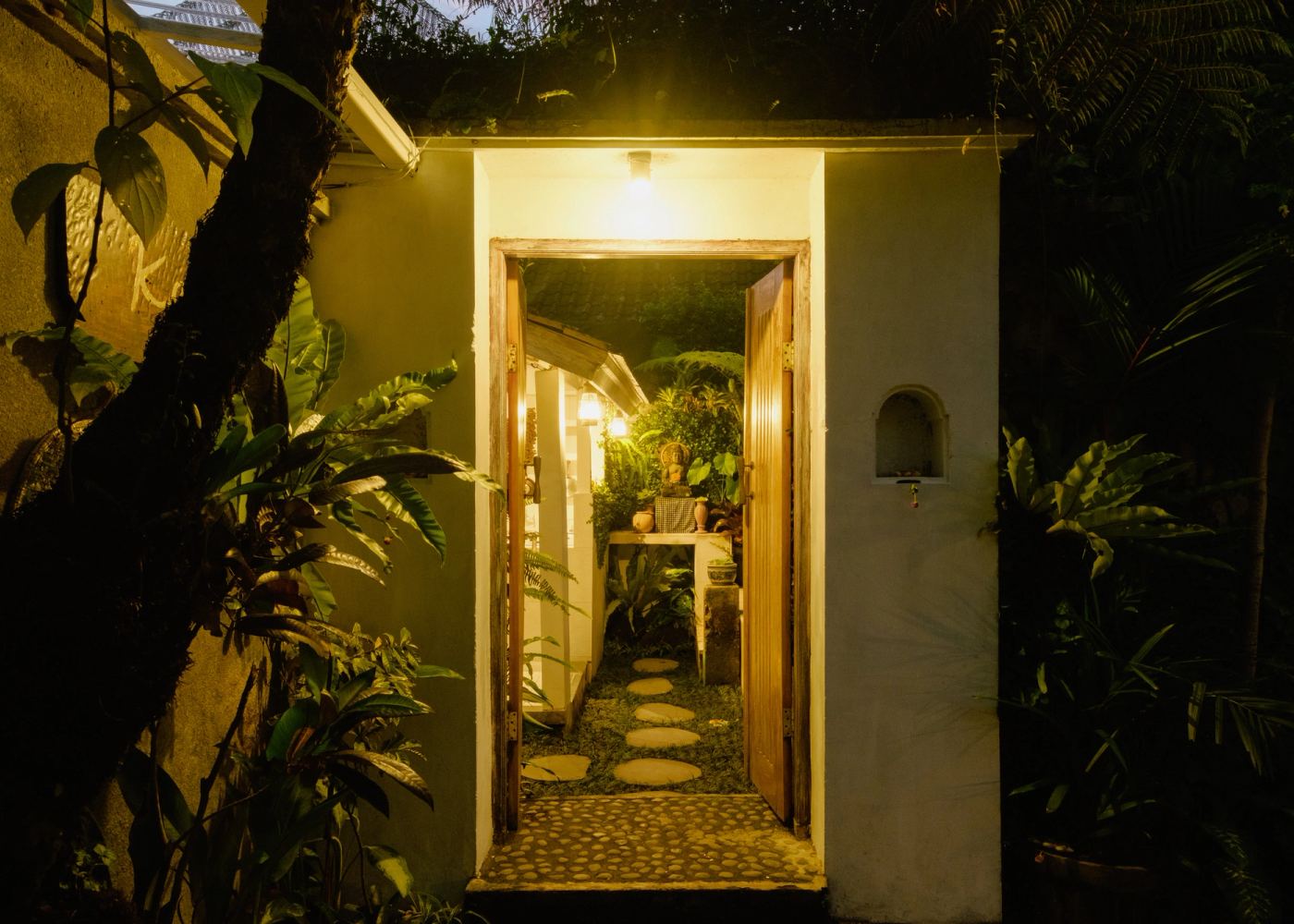 Villa entrance gate lit at night
