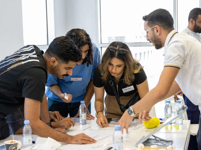 people gathered around a desk