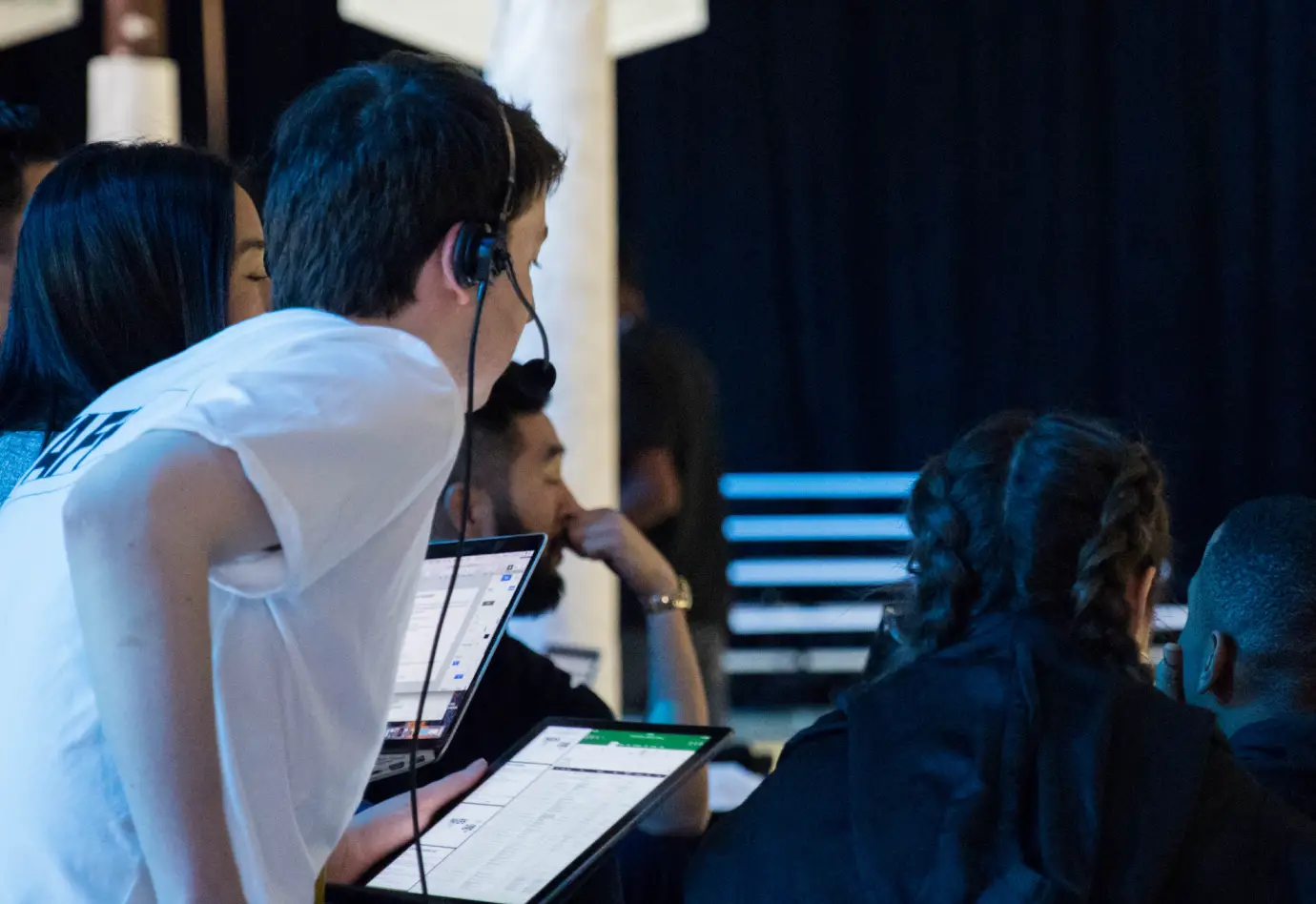 two people looking at something out of picture