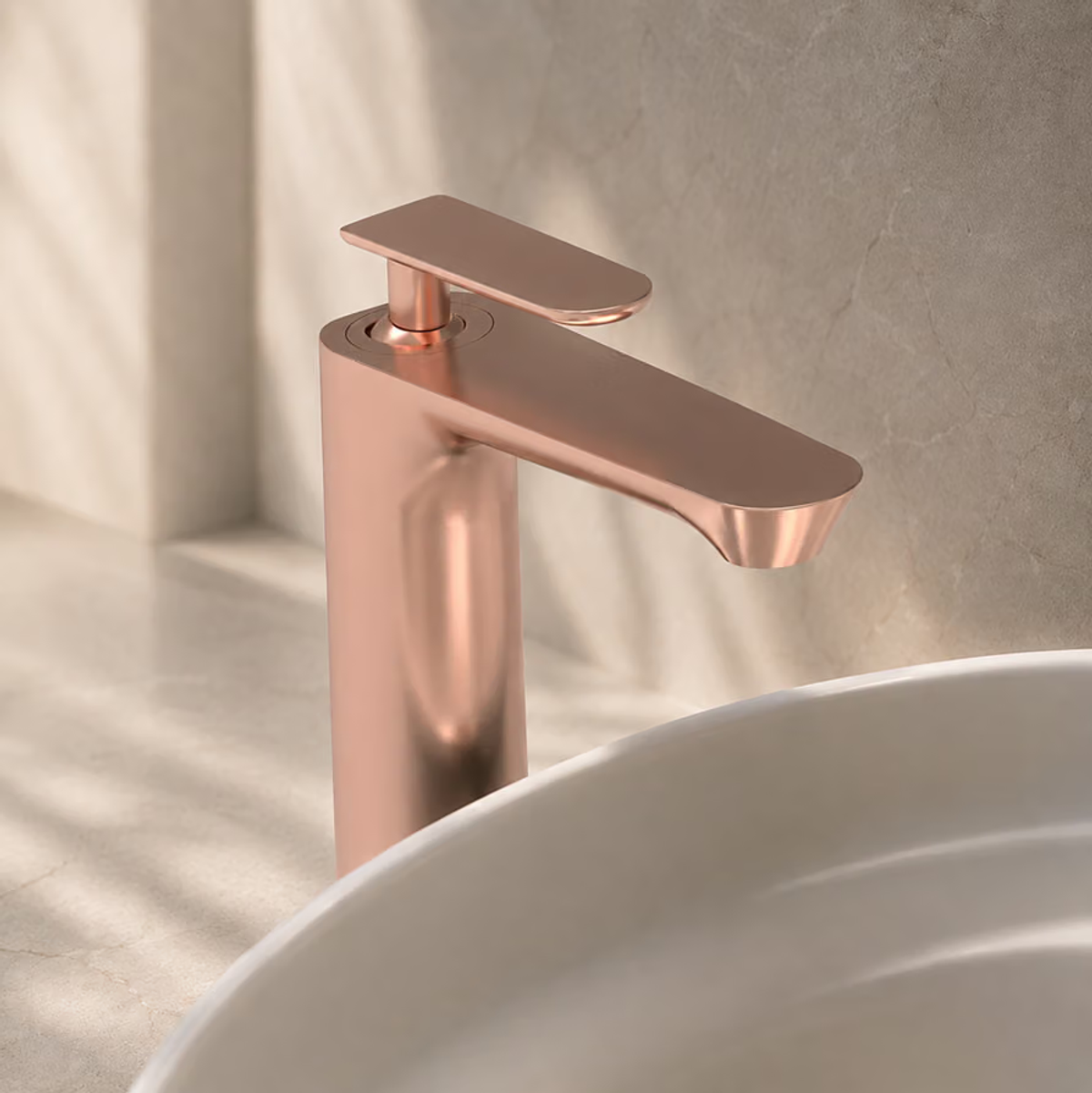 Rose gold single-lever basin mixer above a white basin