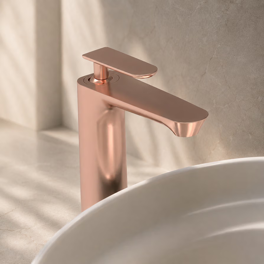 Rose gold single-lever basin mixer above a white basin