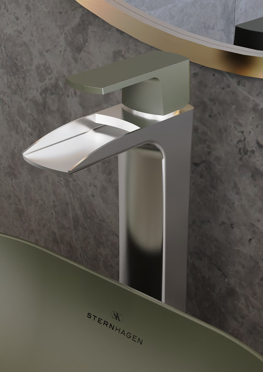 Brushed nickel waterfall basin mixer above an olive green basin with the Sternhagen logo