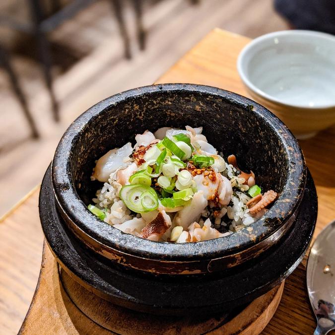 Moon-eo Dolsotbap - Poached octopus over pearl-barley rice and seaweed in stone hot-pot⠀⠀
