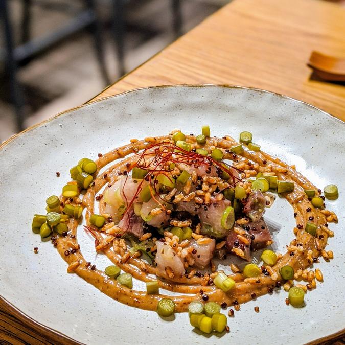 Eohwe - raw king fish, picked garlic-scapes & crispy quinoa brown rice⠀⠀