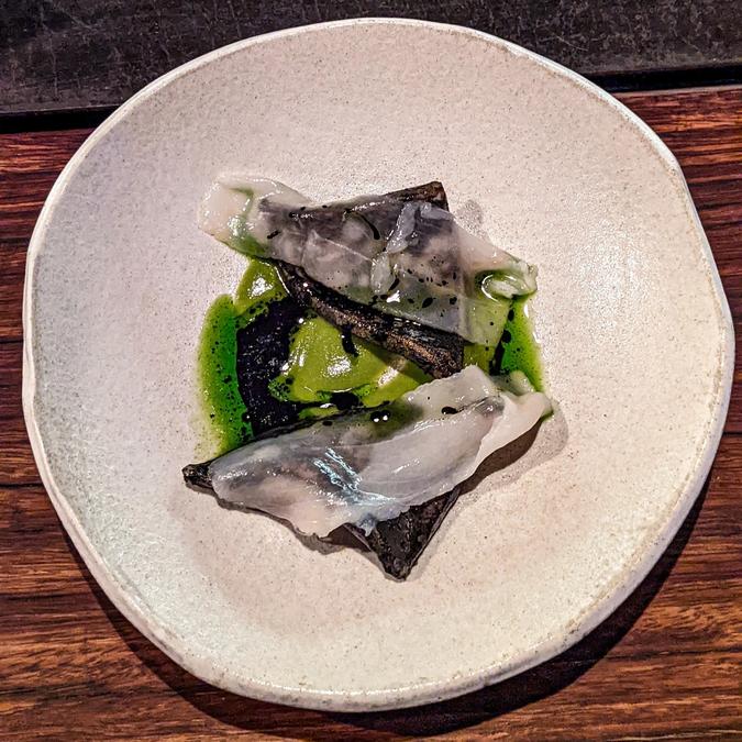 southern calamari with jalapeno & herb sauce, lardo & ink vinaigrette