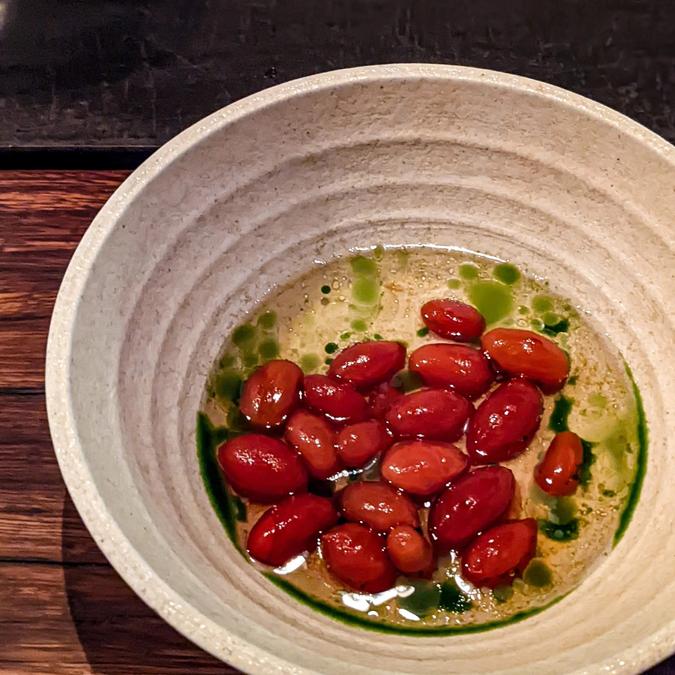 lightly pickled tomatoes in thyme oil and chilli tomato broth