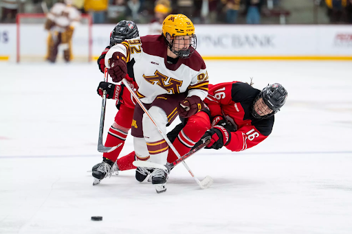 Minnesota’s Ashley Allard (Forward, #92) battles two Ohio State players for puck at Ridder Arena on Oct. 17 (Photo credit: Mac Brown/University of Minnesota Athletics)