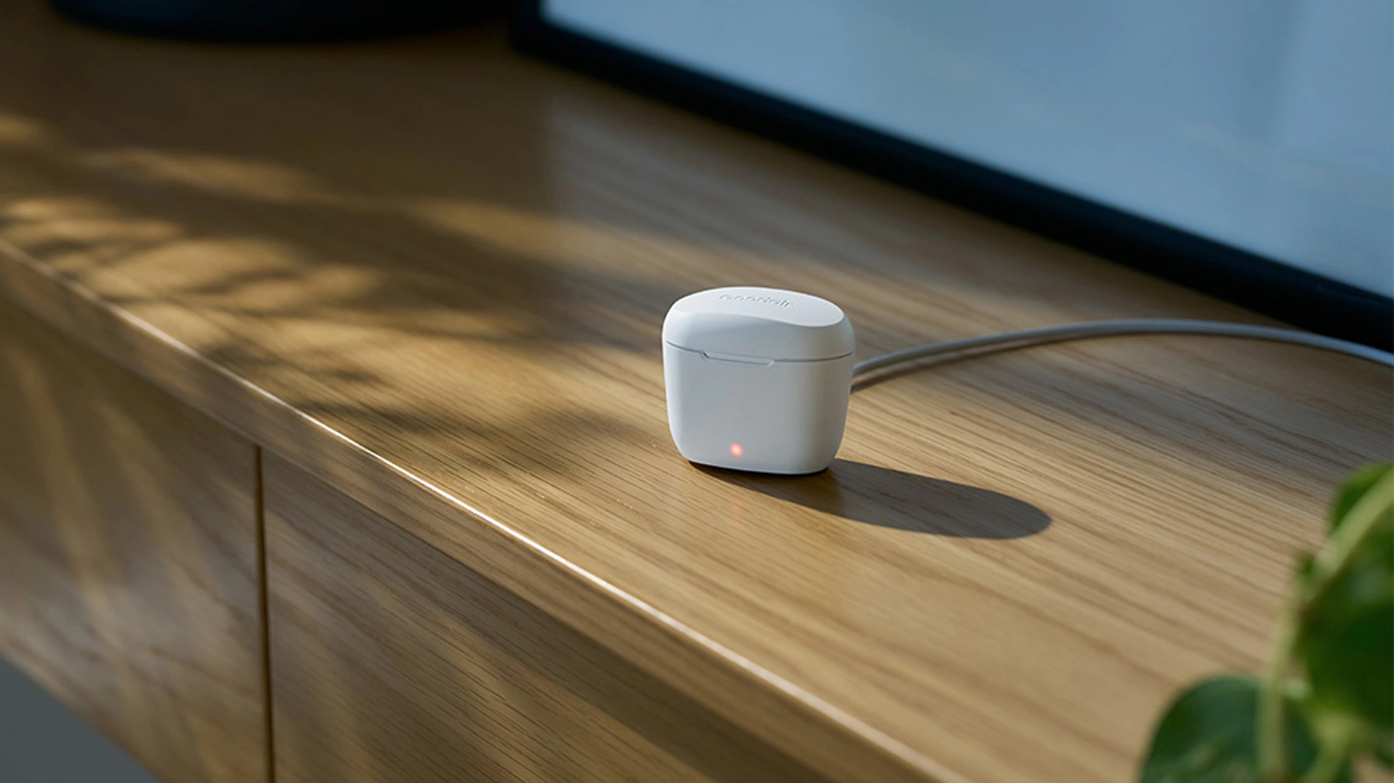 Goodair nosebuds charging on a table