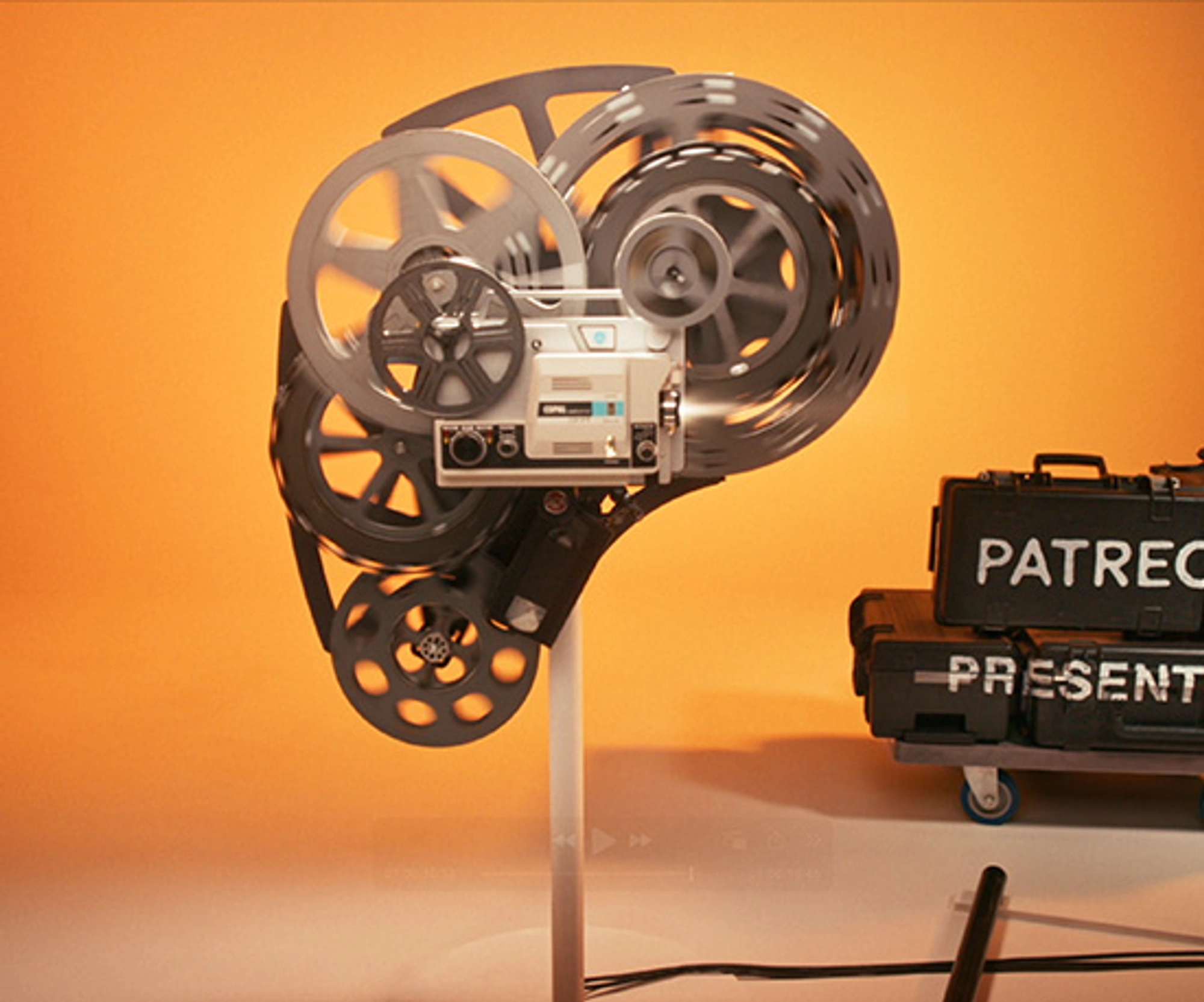 Patreon logo made up of old projector parts
