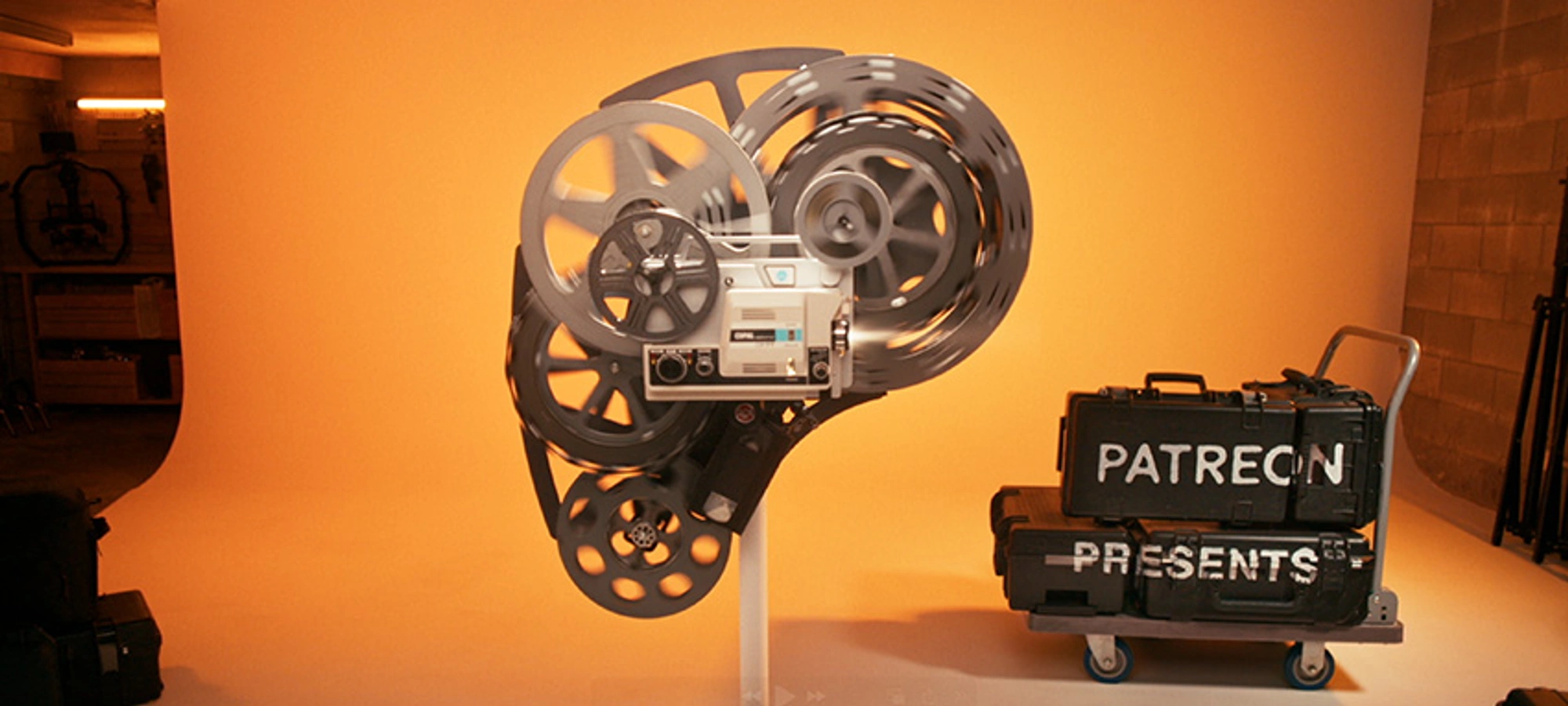 Patreon logo made up of old projector parts