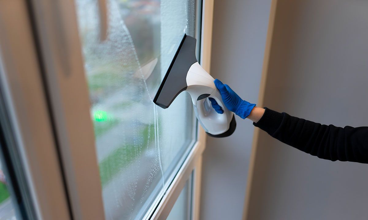 cleaning windows with a squeegee