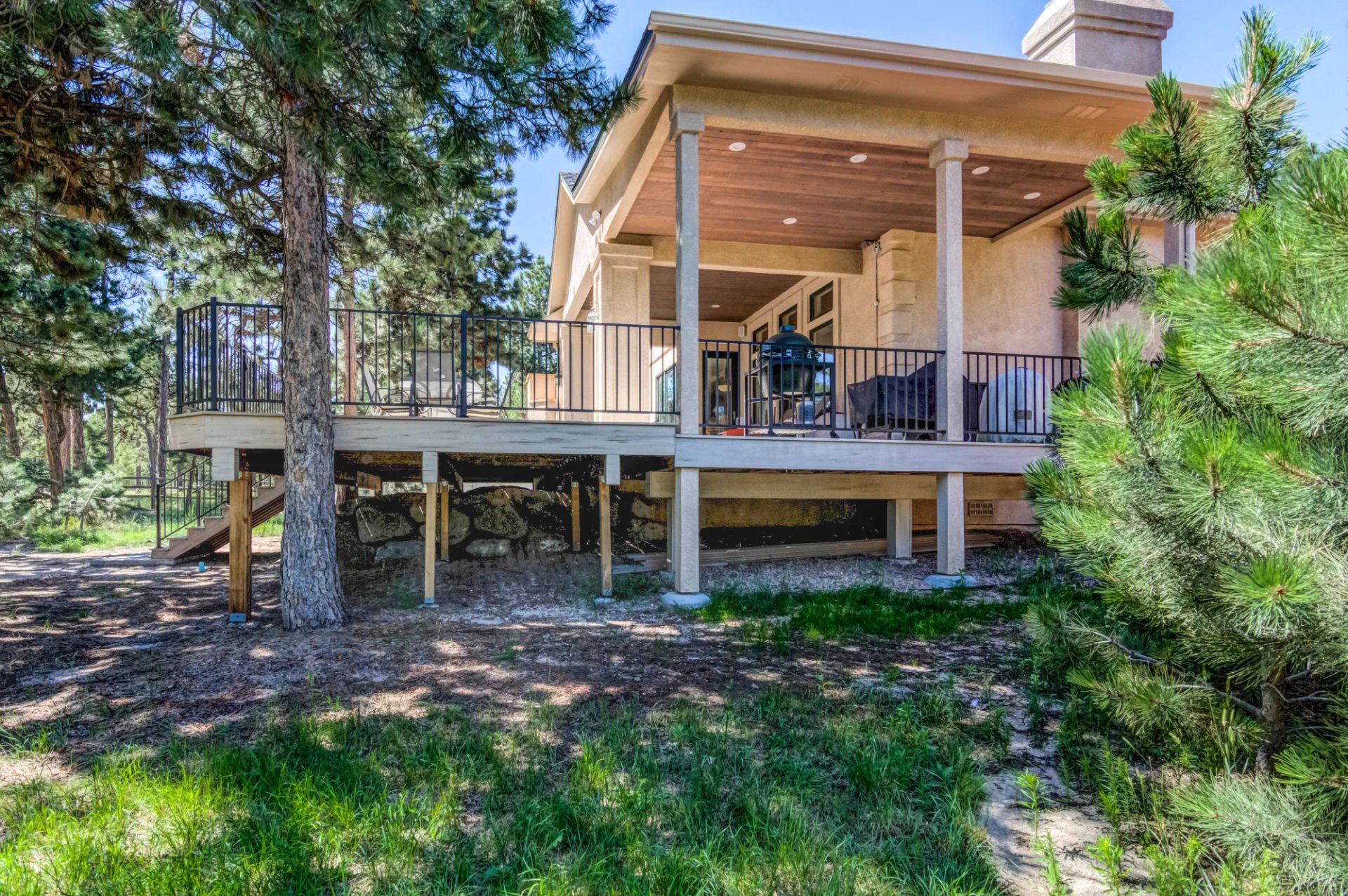Covered deck and outdoor living space by Stewart Remodel Design Build in Colorado Springs