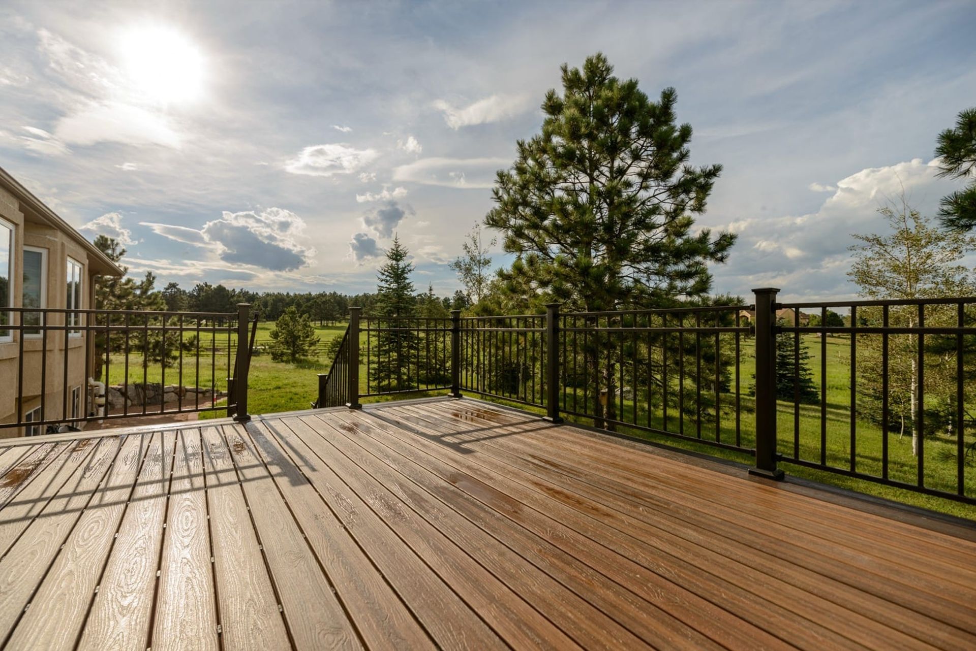 Custom pergola with hot tub and outdoor living space by Stewart Remodeling