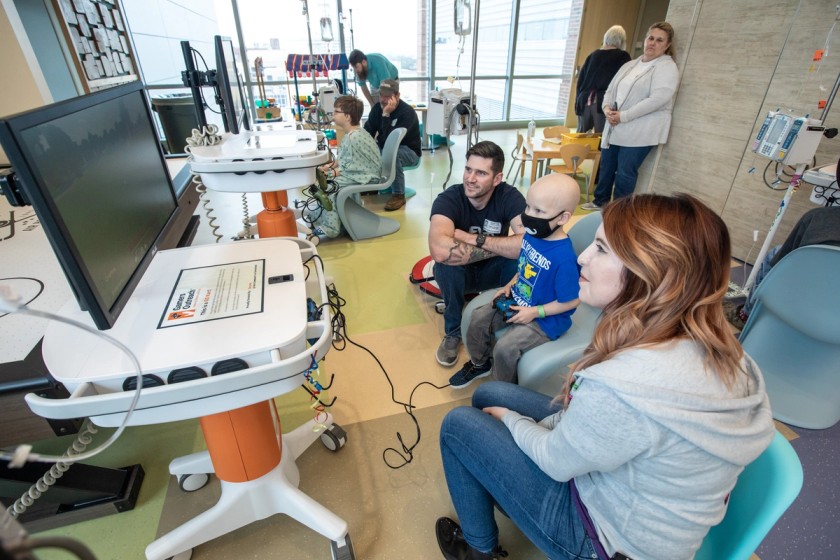 Content Creator plays video games with kids in hospitals on Gamers Outreach Kart