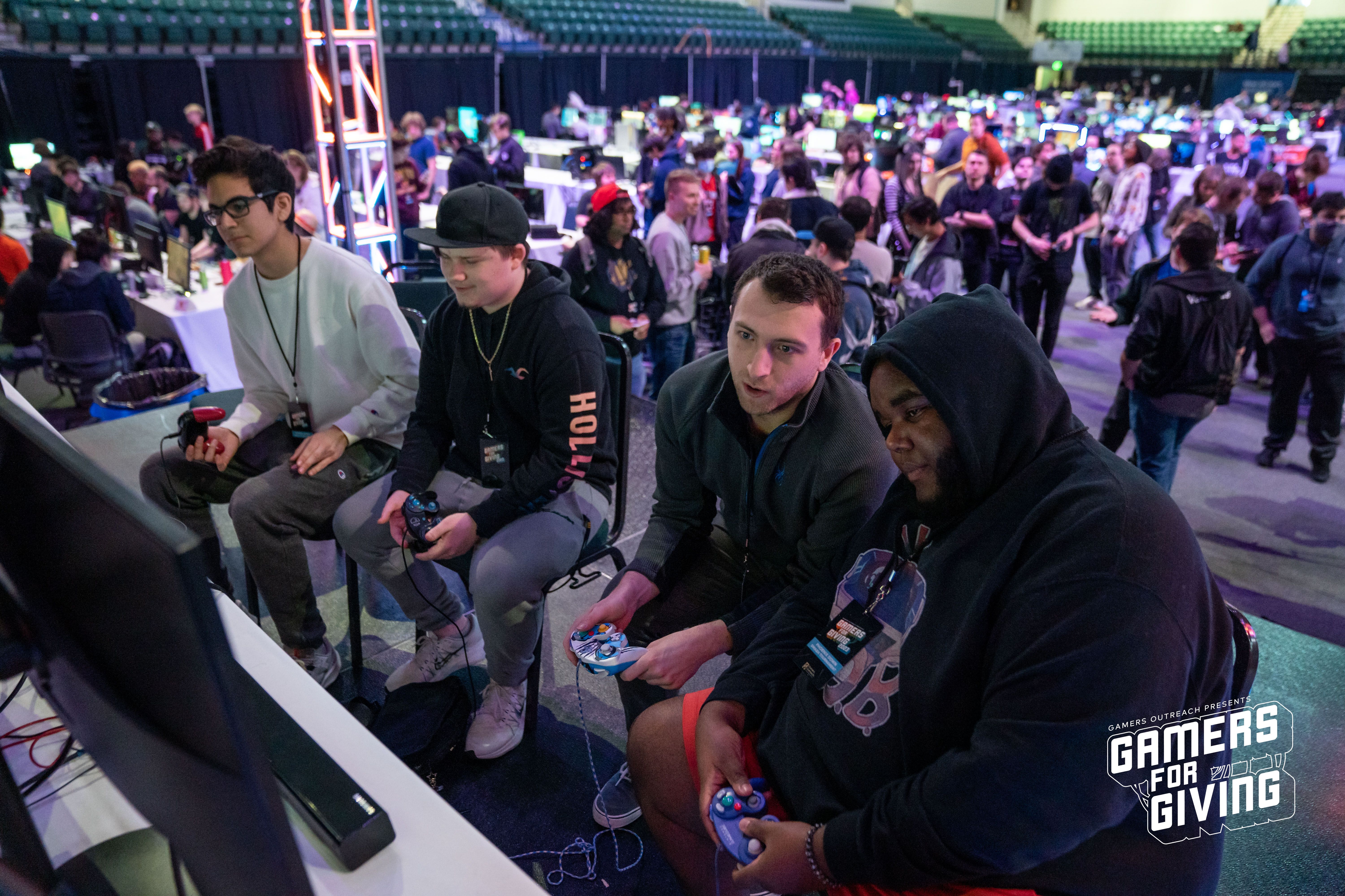 Four gamers getting ready to play Smash doubles at Gamers for Giving 2023.