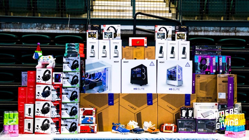 A selection of prizes that were available from event sponsors at Gamers for Giving 2023, including headsets, keyboards, mice, PC cases, streaming microphones, drinks and more.