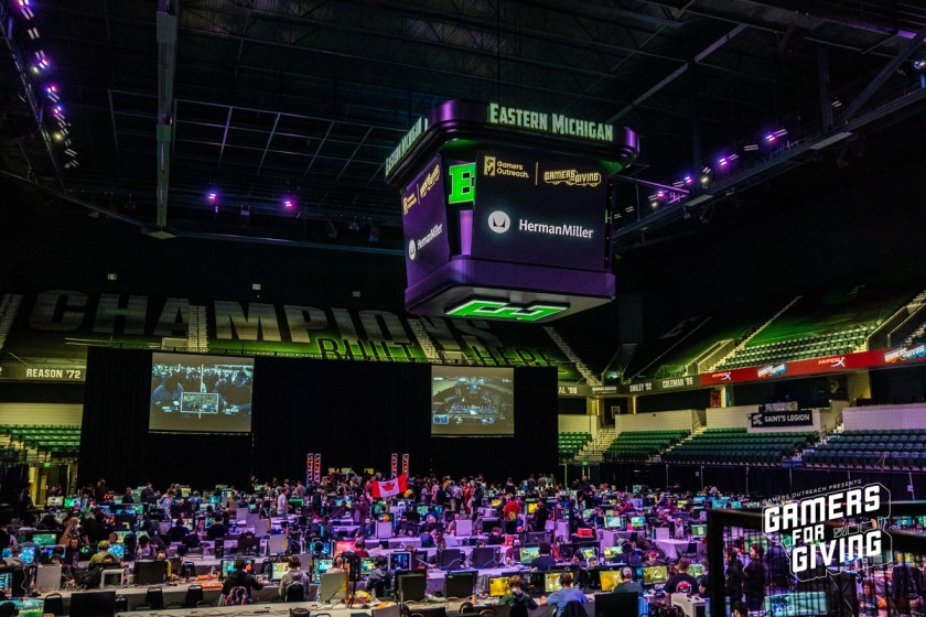 Wide shot of the LAN area at Gamers for Giving 2023 showing hundreds of gamers at their LAN stations.