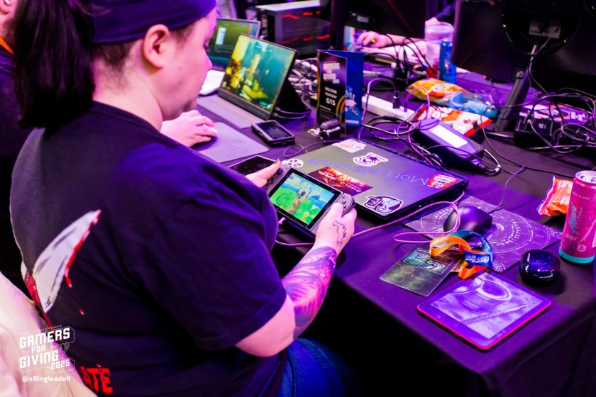 A GFG LAN attendee enjoys some Animal Crossing: New Horizons at her seat.