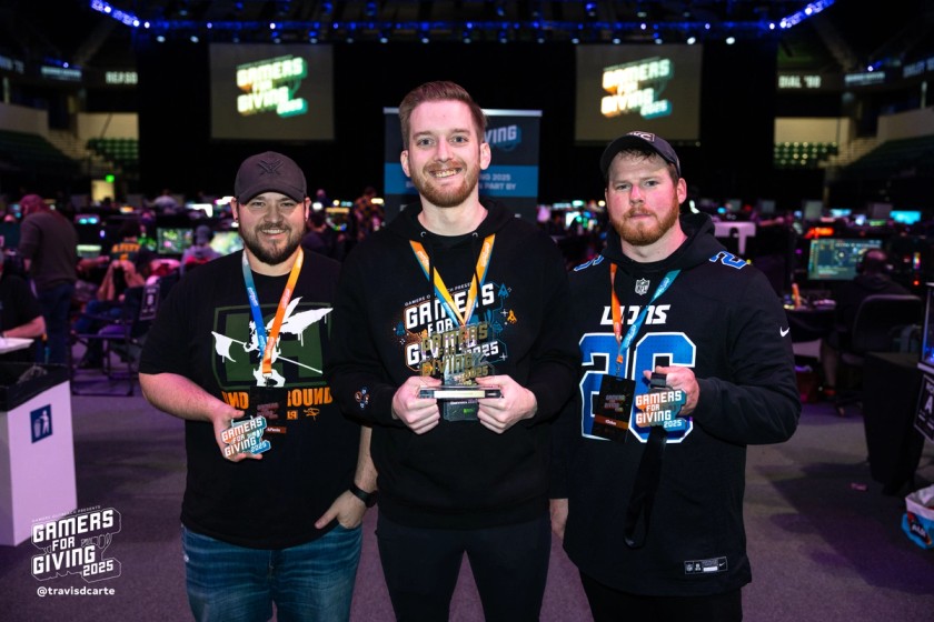 GFG participants posing with medals and a trophy