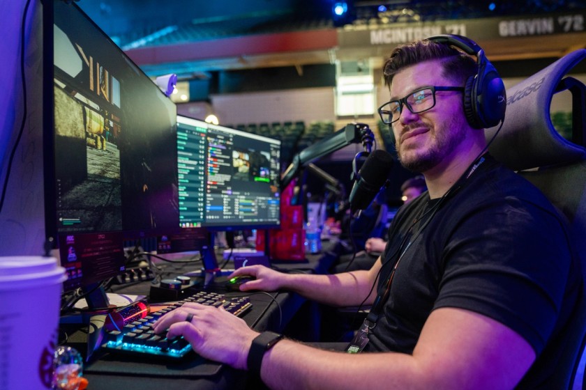 Markstrom winking at the camera while gaming at his streaming setup in the Gamers for Giving 2024 LAN benefitting Gamers Outreach.