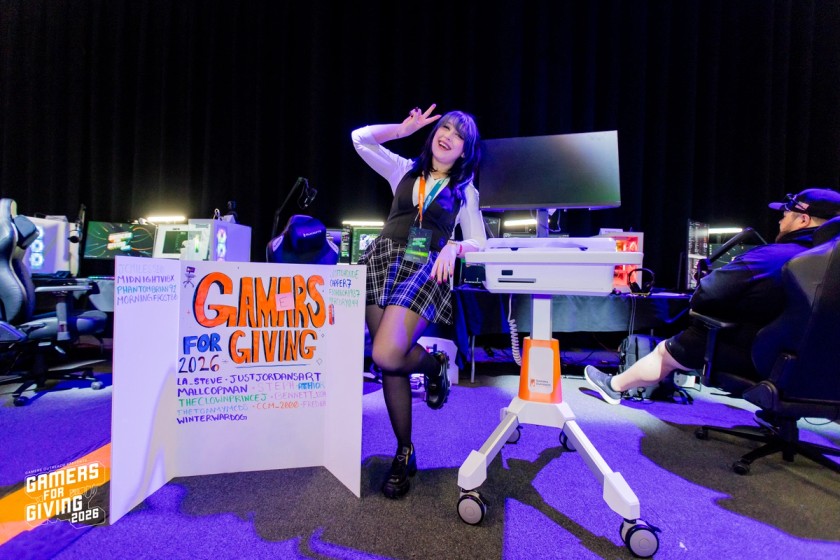 Queen Manda posing with her donation board