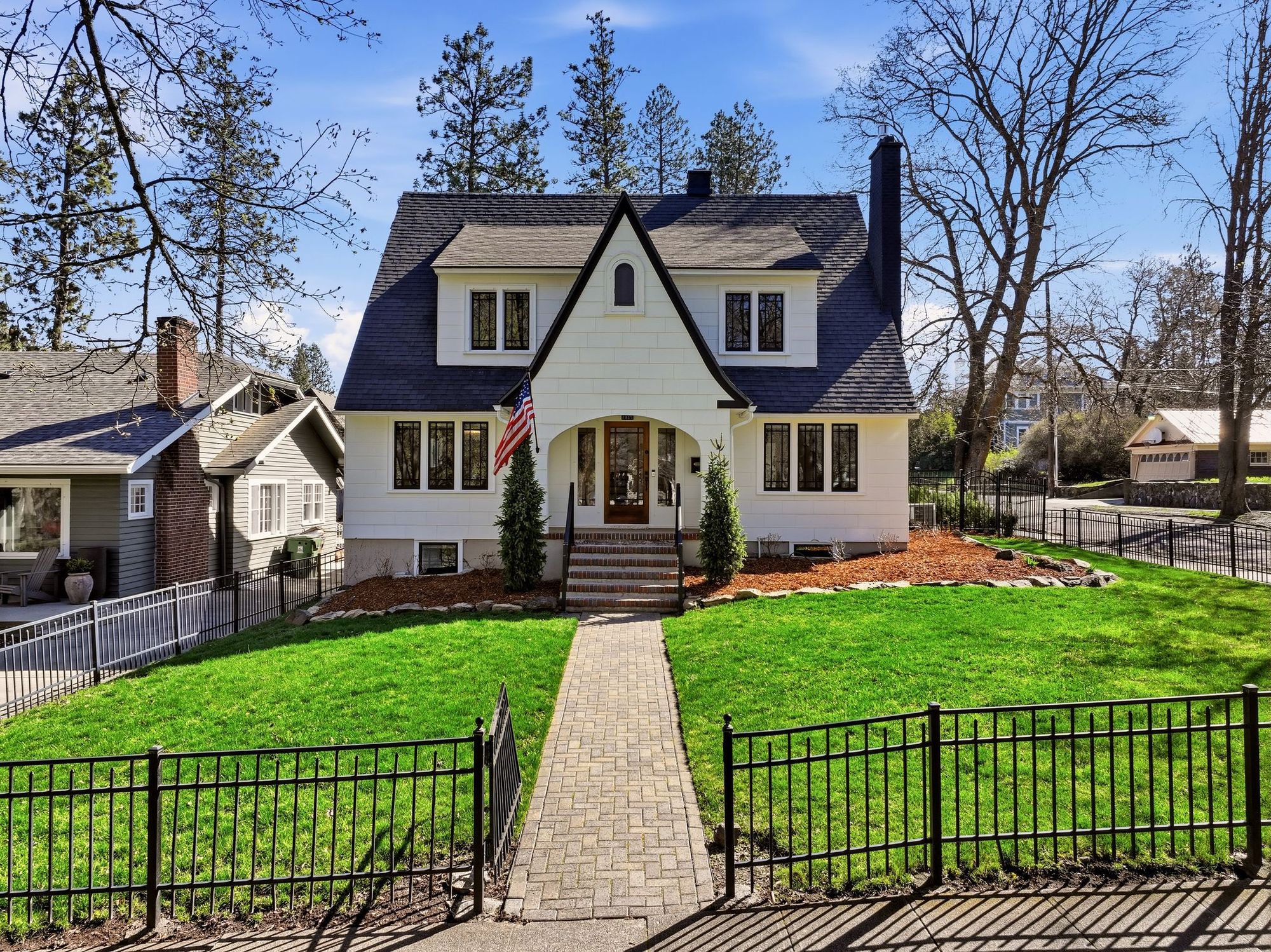 A storybook cottage on Manito Boulevard, with a carriage house