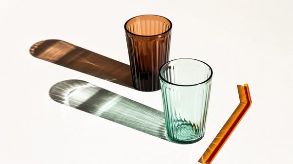 Two glasses and a straw by Boglarka Salamon