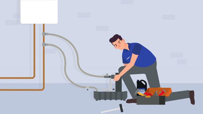 Illustration of an engineer connecting the ADEY MagnaCleanse unit to the heating system.