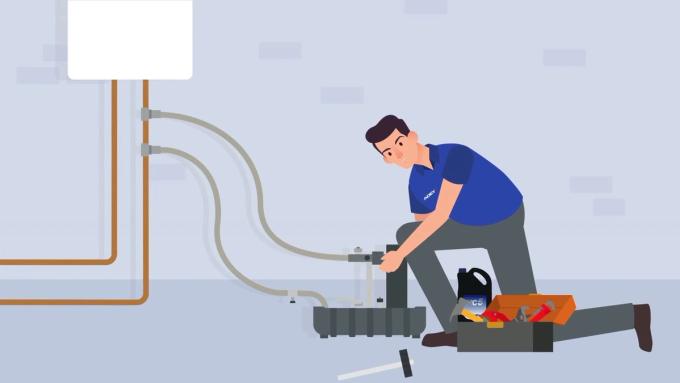 Illustration of an engineer connecting the ADEY MagnaCleanse unit to the heating system.