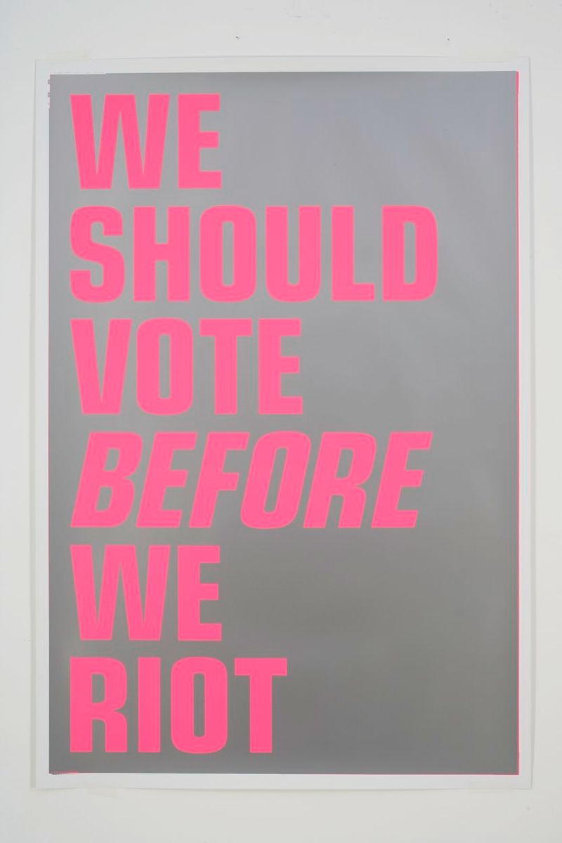 Installation view of displayed artwork titled WE SHOULD VOTE BEFORE WE RIOT