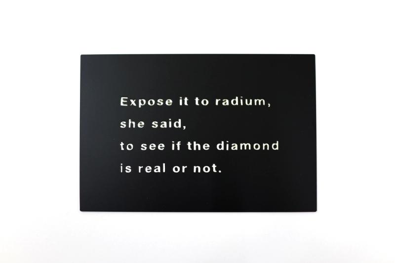 Installation view of displayed artwork titled Expose it to radium, she said, to see if the diamond is real or not
