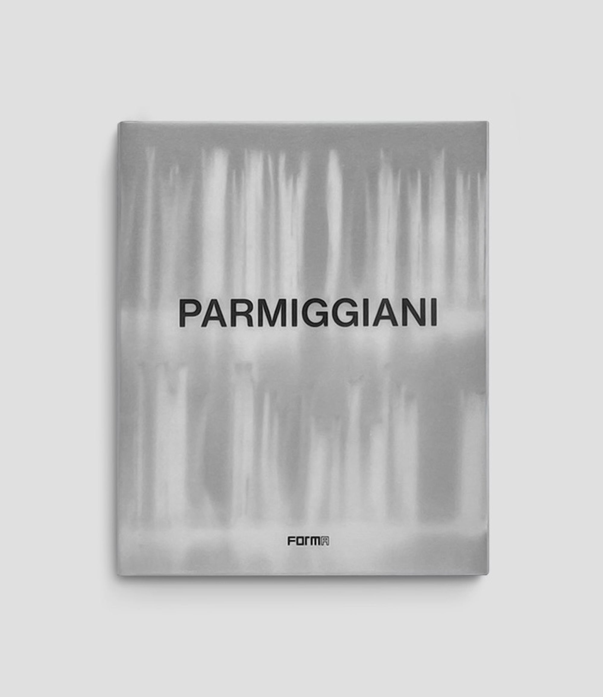 Book cover on plain background with title of Parmiggiani
