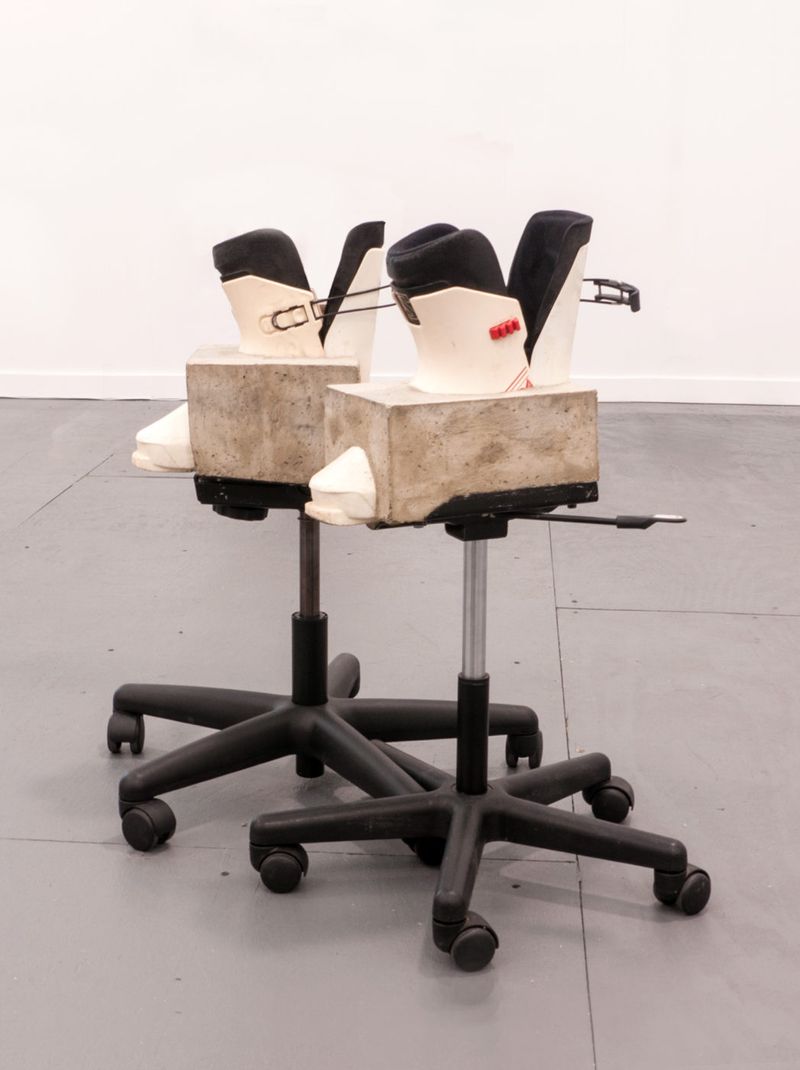 Installation view of displayed artwork titled Gas Lift Ski Boots