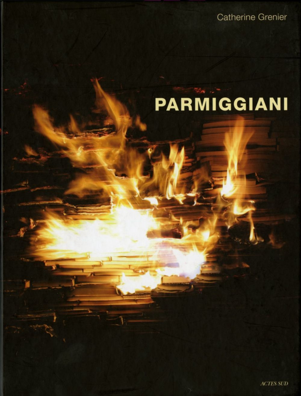 Book cover on plain gray background with title of Parmiggiani 