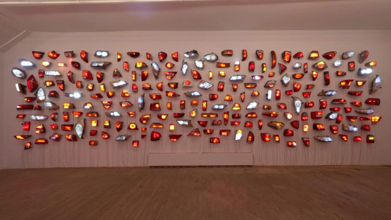 Installation view of displayed artwork titled Heads/Tails: Walker & Broadway 1