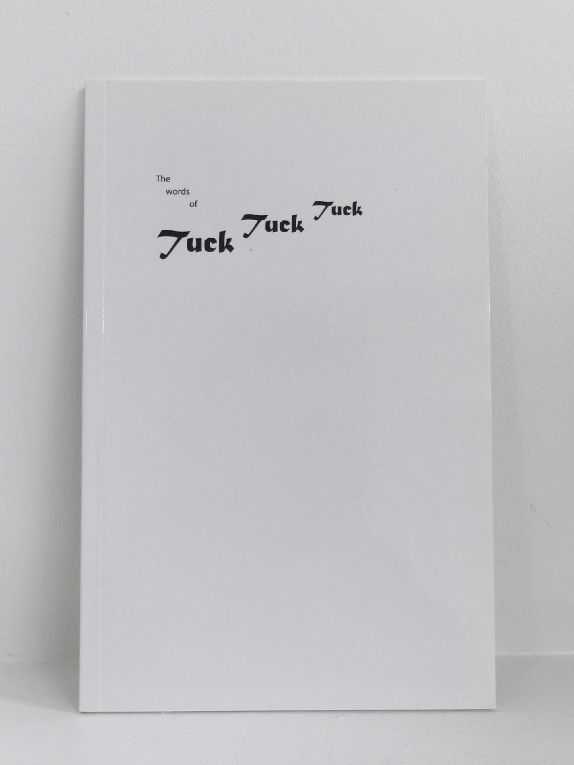 Detail view of The Words of Tuck Tuck Tuck against a plain gray background