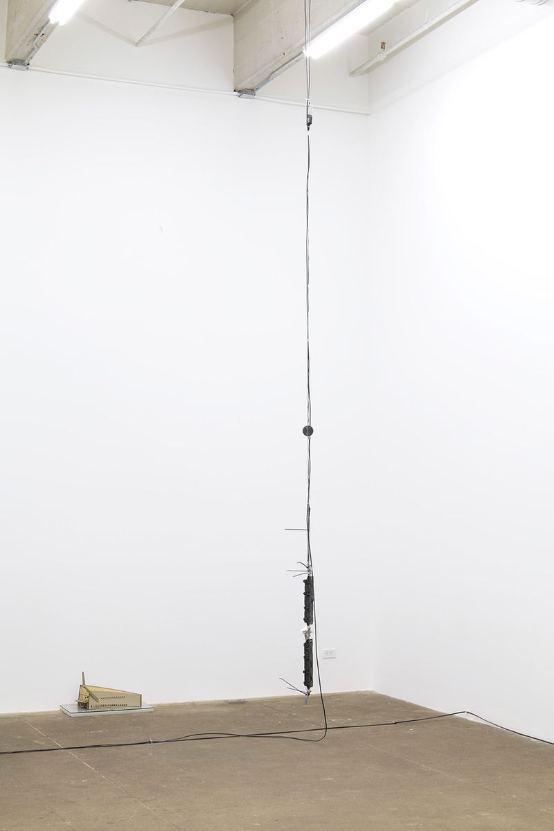 Installation view of displayed artwork titled One Calorie as Good as Another/Epoch Defining Broadcast (brown collapsed)